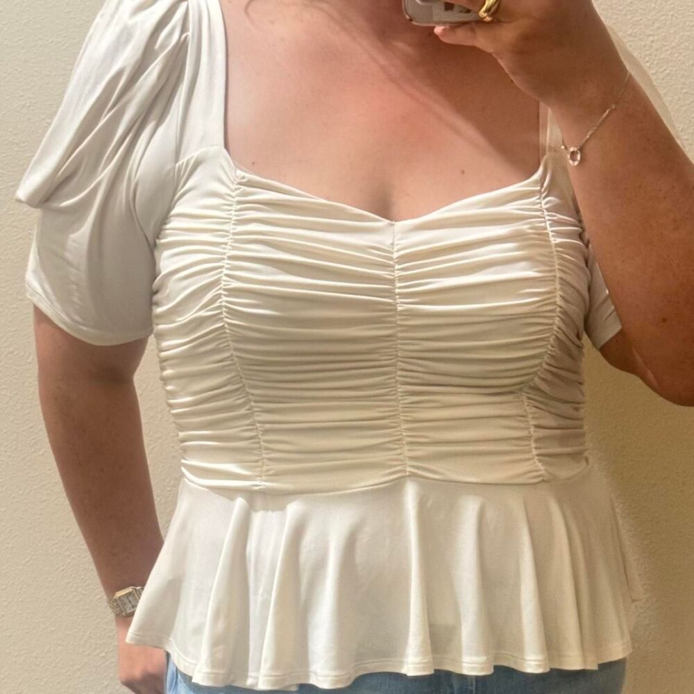 Express women’s top in size XL in a soft ivory/cream color